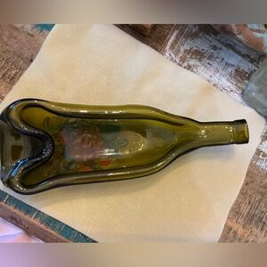 Slumped wine bottle with decal